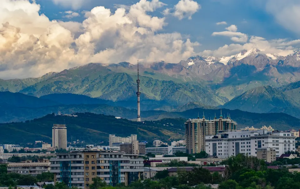 Almaty cityscape and TV tower beneath the Trans-Ili Alatau mountains