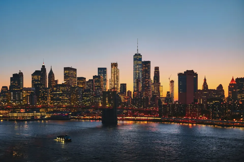 Lower Manhattan skyline at dusk across the East River, New York